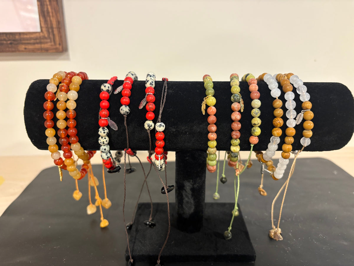 Beaded bracelets with feather charm